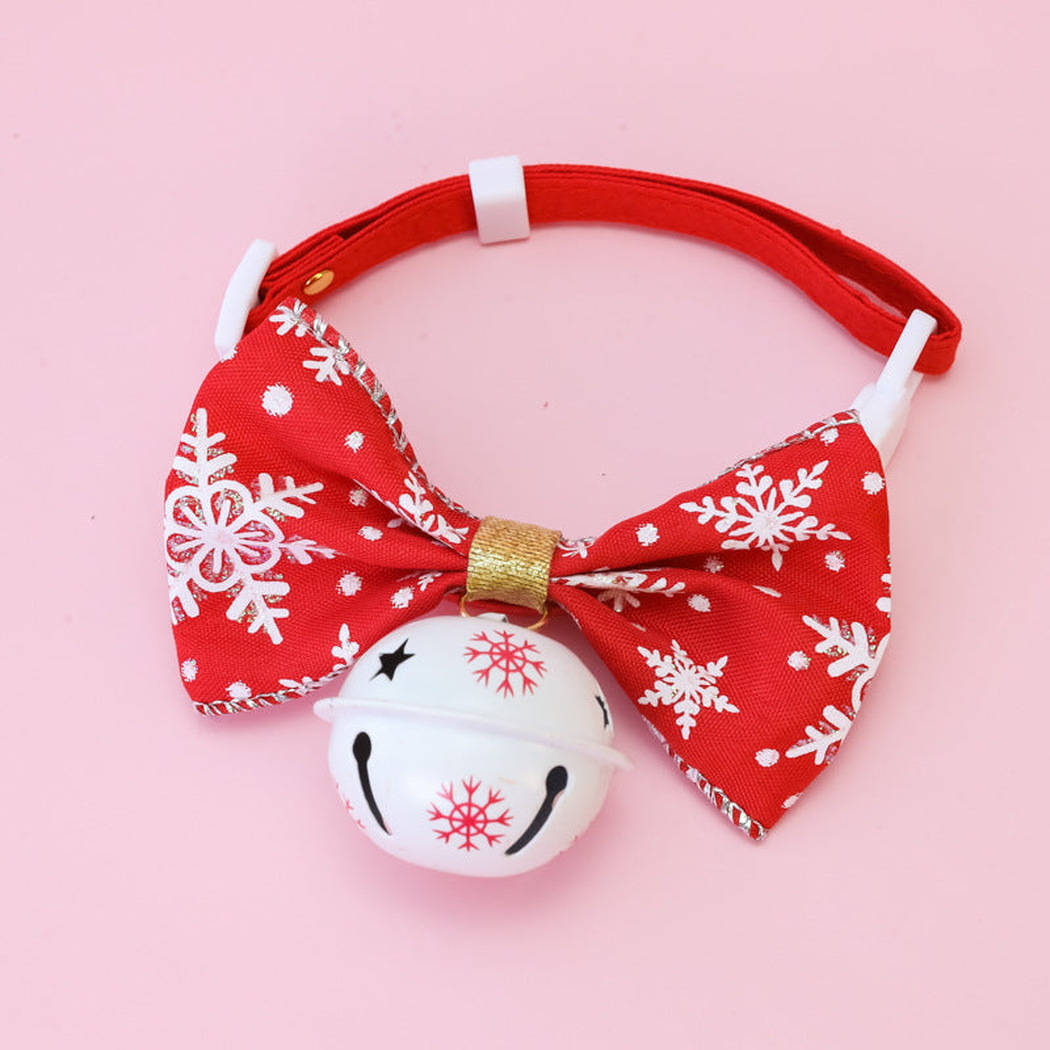 Red Snowflake pet collar with a bow and white bell, front view