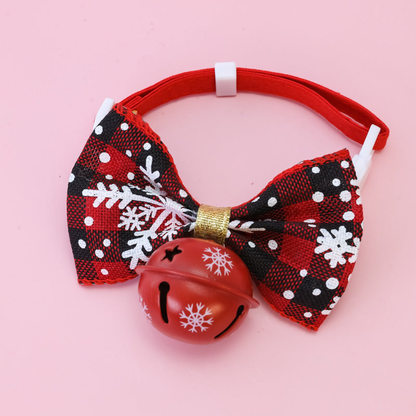 Black Snowflake pet collar with a bow and red bell, front view