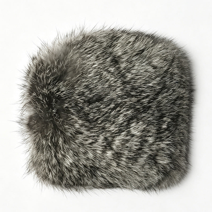 Round cat toy with a dark furry exterior on a white background