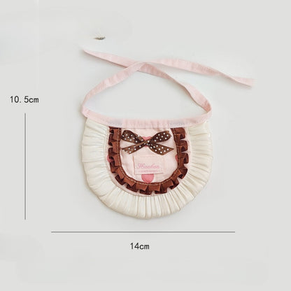 Side view of Mokka cat wearing the polka dot bow bib