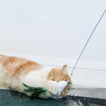 Hand holding Moo Classic Feather Extendable Cat Teaser Wand with feathers at the tip