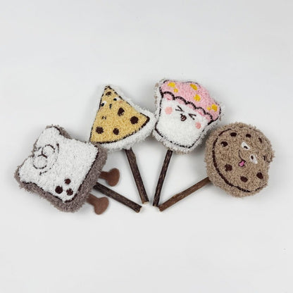 Moo plush cat stick toy held in hand to show size and texture