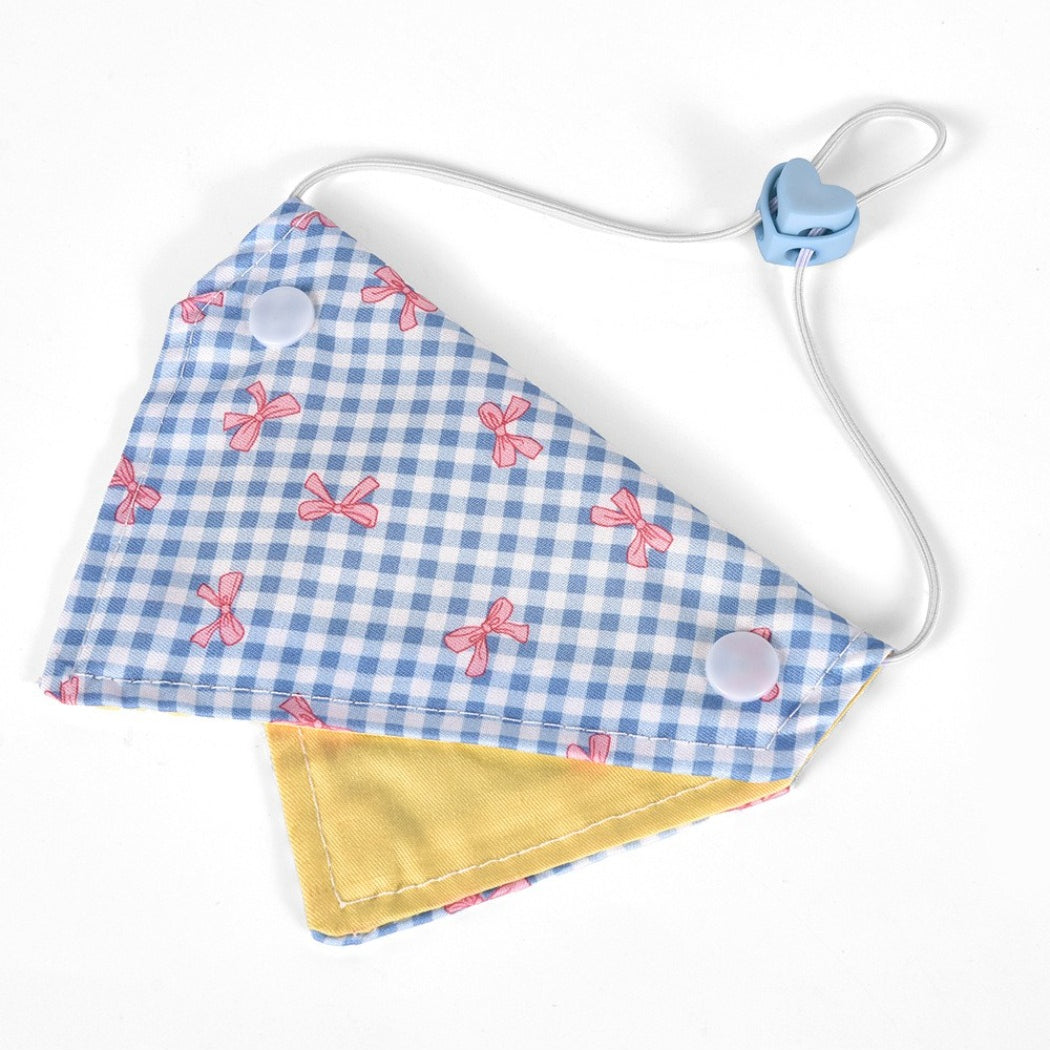 Close-up of Mokka Bow Print Cat Bandana Collar fabric and bow detail