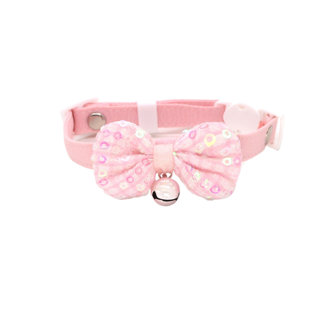 Close-up of pastel bow and bell detail on pink cat collar