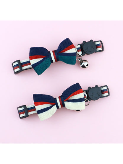 Close-up of Mokka striped bow on adjustable cat collar with breakaway feature