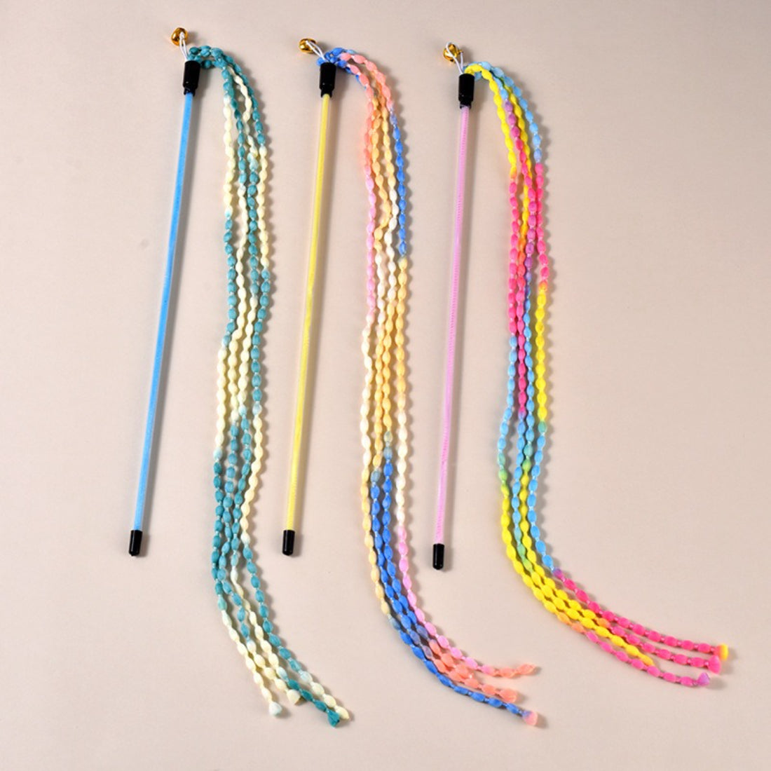 Moo braided cord cat teaser wand coiled to show texture and length of braided handle