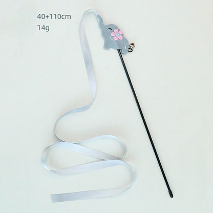 Colorful ribbon wand cat toy with ribbons spread out on a flat surface