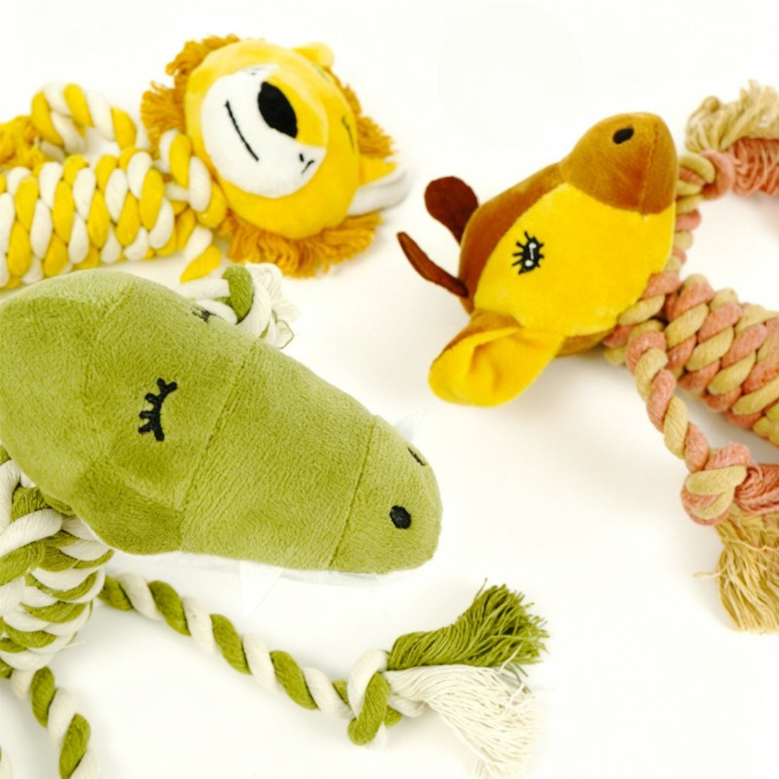 Petkin rope dog plush toy held in hand to show size and texture