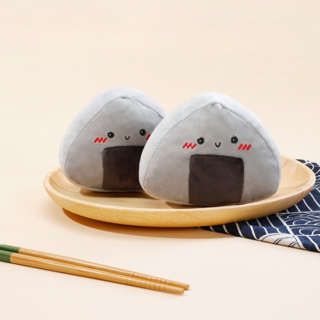Close-up of Petkin Onigiri Rice Ball plush dog toy showing soft texture and rice ball shape