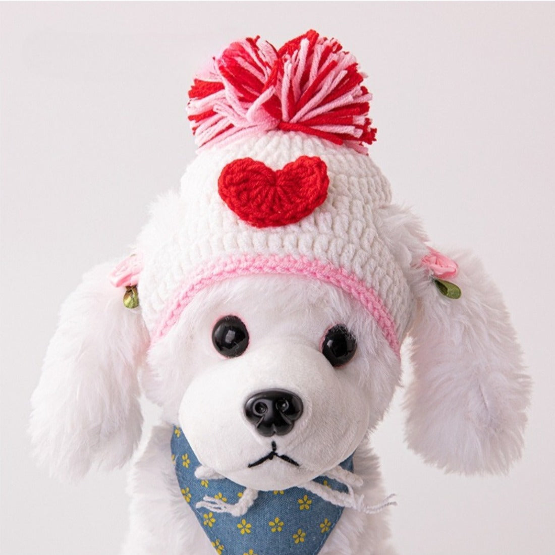 Side view of Ozzie Pom Pom Knit Cat Hat showing knit pattern and pom pom
