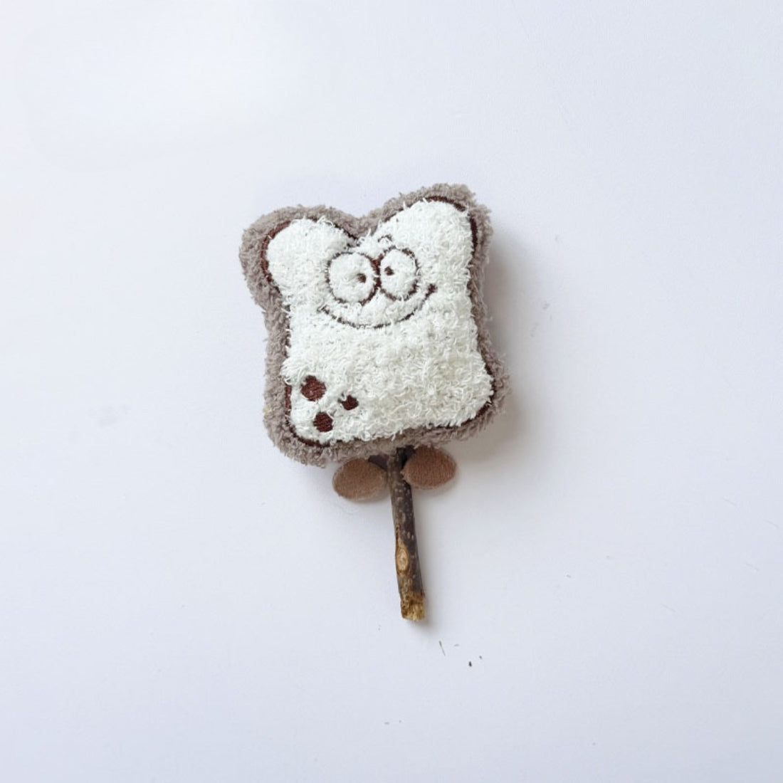 Moo plush cat stick toy displayed on a plain background highlighting its shape