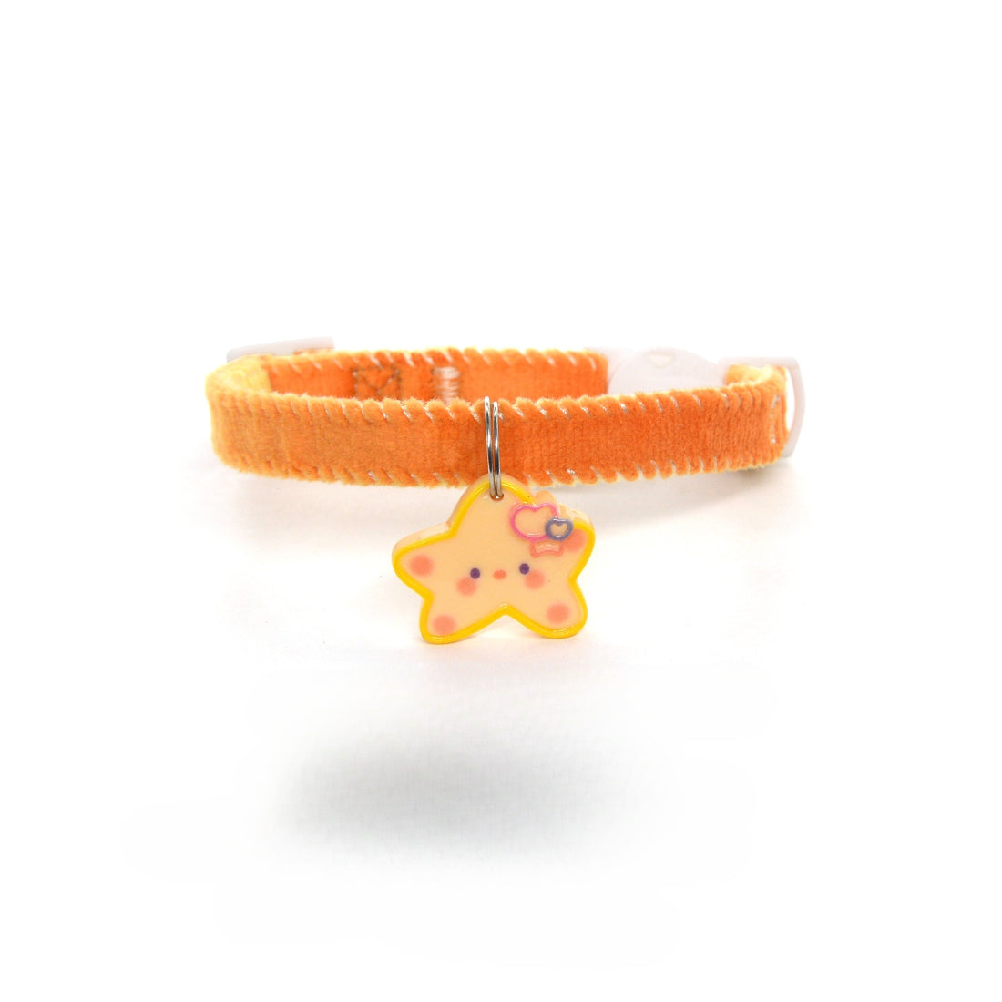 Mokka Simple Star Charm Collar displayed with matching gold earrings on white surface