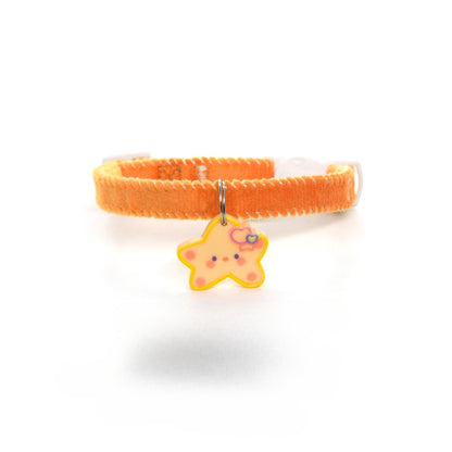 Mokka Simple Star Charm Collar displayed with matching gold earrings on white surface