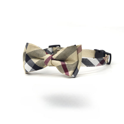 Close-up of Mokka plaid bow cat collar showing the bow detail and adjustable buckle