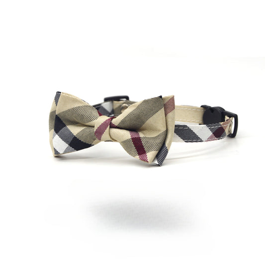 Close-up of Mokka plaid bow cat collar showing the bow detail and adjustable buckle