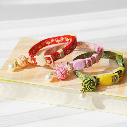 Side view of Mokka Pearl Flower Cat Collar with pearl flower embellishment