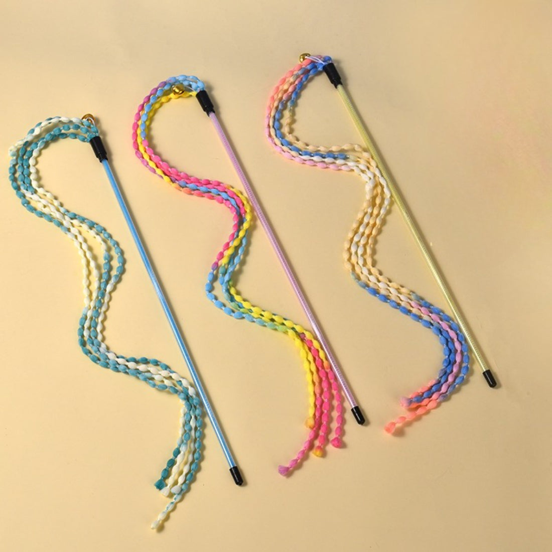 Close-up of the braided cord handle of the Moo cat teaser wand showing detailed weaving