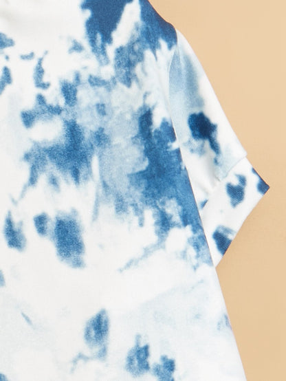 Close-up of dog’s chest area highlighting the tie dye t-shirt fabric texture