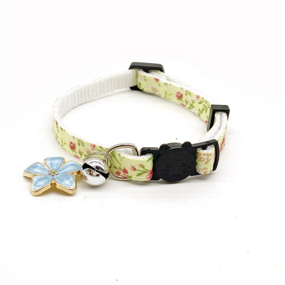 Mokka floral bell charm cat collar displayed flat with visible pattern and bell