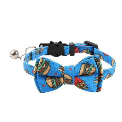 Close-up of Mokka cat collar featuring colorful food illustrations and attached bell