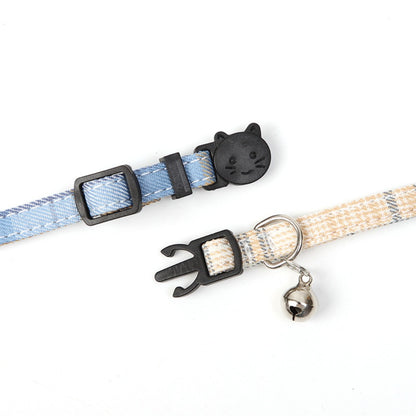 Side view of Mokka adjustable checkered bow tie cat collar highlighting breakaway clasp mechanism