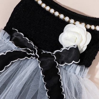 Ozzie pet dress in soft pink tulle with bow, styled on pet mannequin