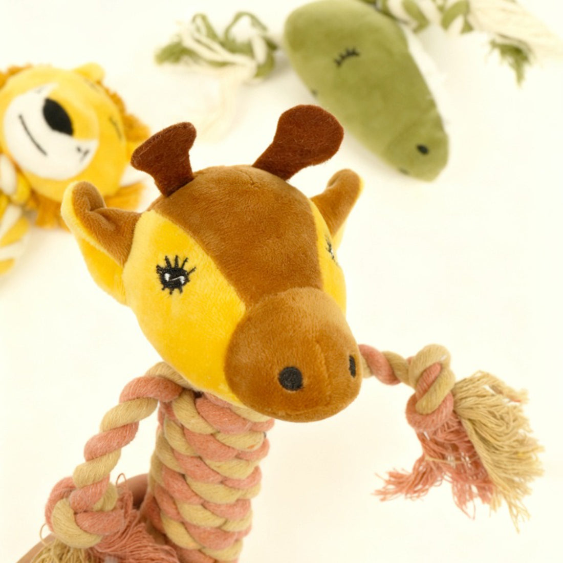 Close-up of Petkin rope dog plush toy showing soft fabric and stitched animal features