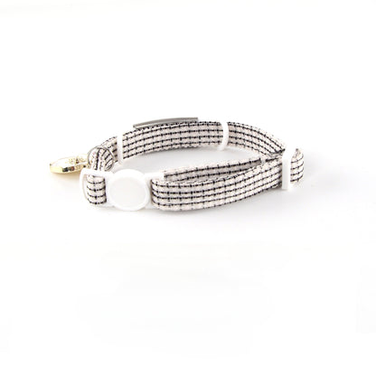 Pink adjustable cat collar featuring a delicate rose charm and safety breakaway clasp
