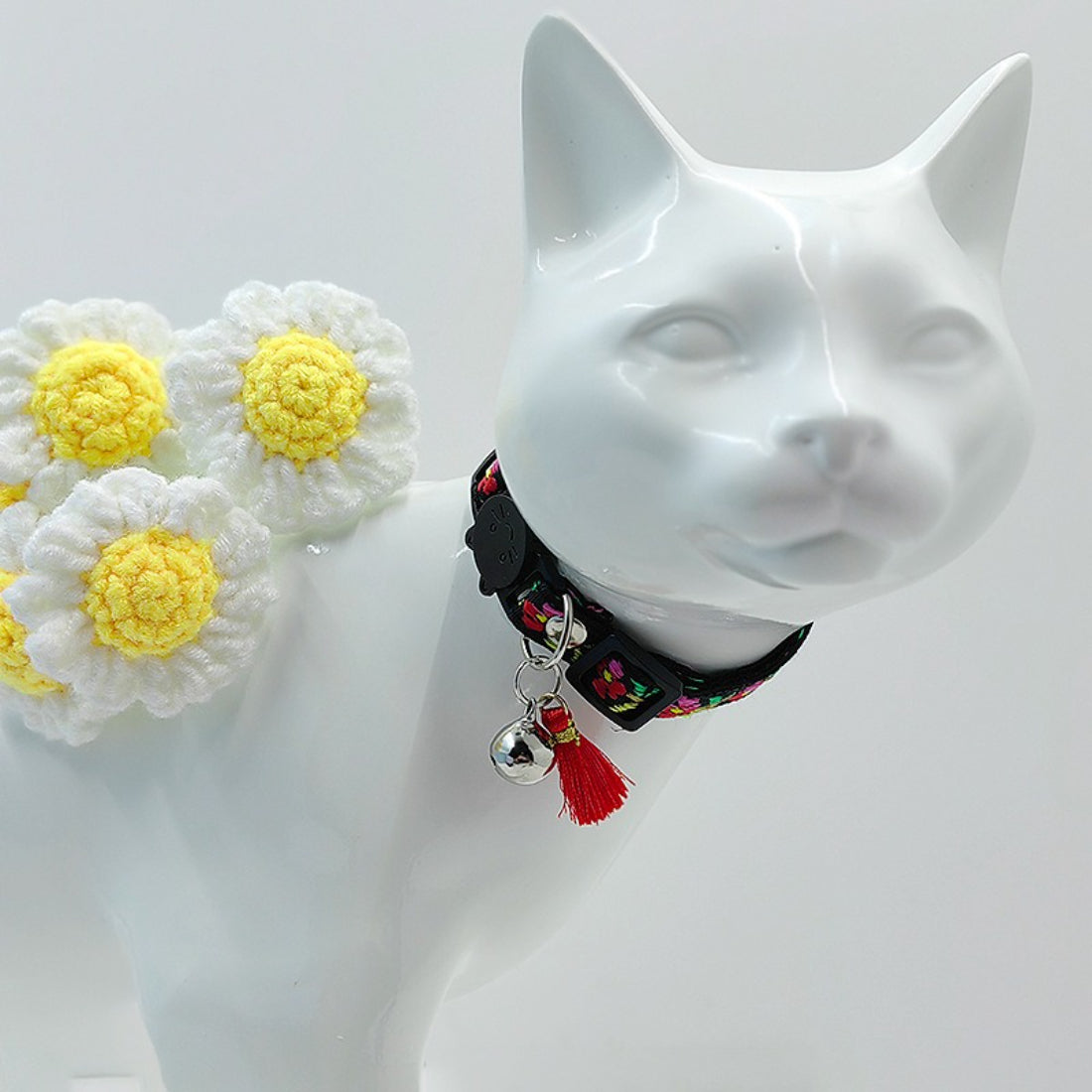 Mokka cat collar with bright floral design, tassel, and bell hanging