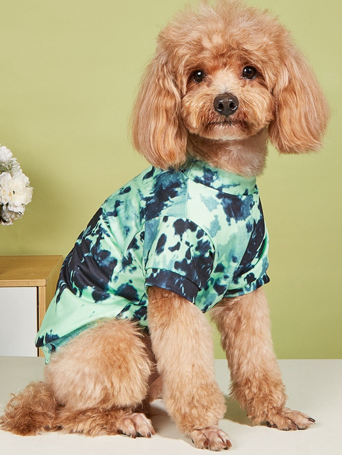 Side profile of a dog wearing a soft cotton tie dye t-shirt in pastel shades