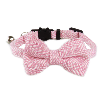 Mokka cat collar with herringbone bow tie shown from above on plain surface
