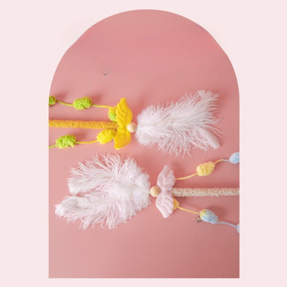 Close-up of Moo Interactive Feather Wand showing vibrant feathers attached to wand