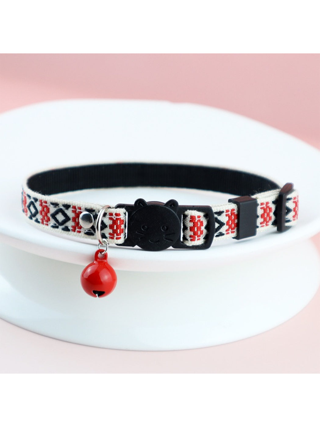 Close-up of metal D-ring on Mokka colorful woven cat collar for attaching tags