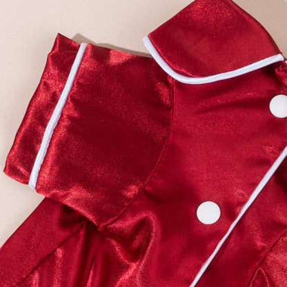 Dog in a chic satin shirt with a bow, photographed on a plain white background