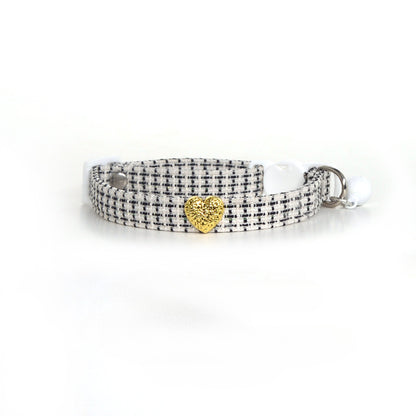Mokka tweed heart cat collar packaging with collar neatly arranged inside