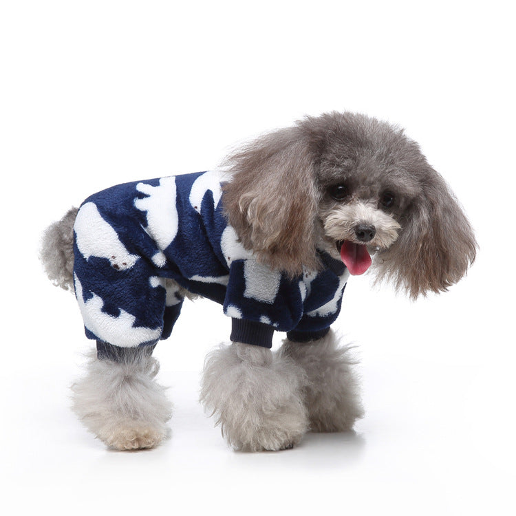 Dog in Ozzie Bear Design Dog Pajamas relaxing on a pet bed, looking comfortable