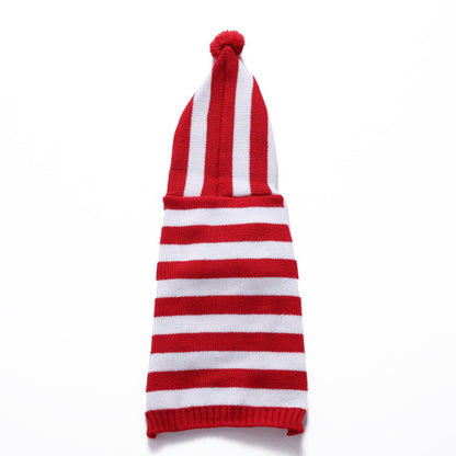 Ozzie soft dog pajamas with hat on dog lying down
