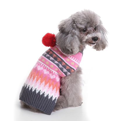 Small dog wearing Ozzie soft pajamas and hat sitting on floor