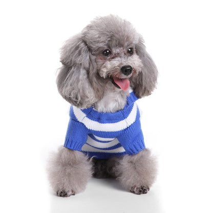 Dog wearing Ozzie soft pajamas and hat sitting upright