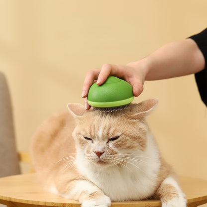 Happy cat being groomed with the Ruffle Avocado Cat Comb