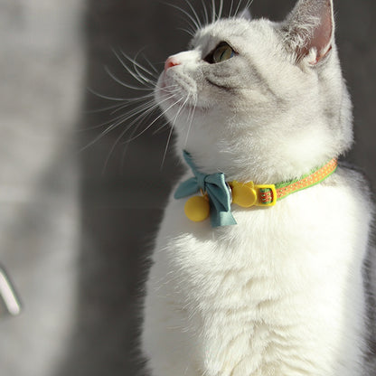 Mokka cat collar with bowknot and bell displayed with strap adjustment visible