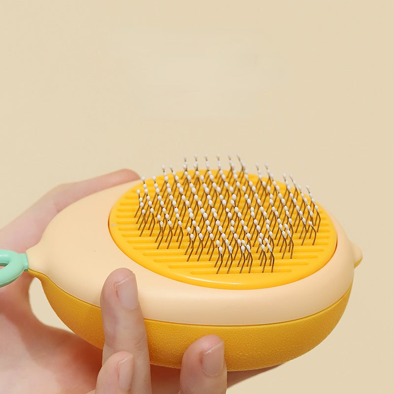 Ruffle Avocado Cat Comb next to grooming products