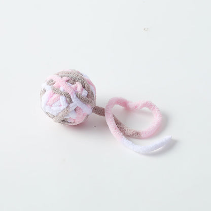 Moo Cat Toy Ball with orange and white design shown from a top angle