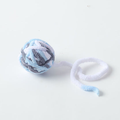 Moo Cat Toy Ball captured from a low angle showing orange and white colors