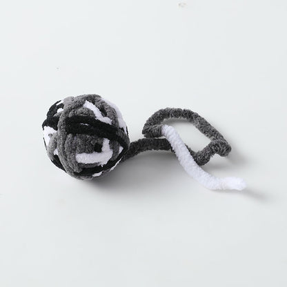 Moo Cat Toy Ball photographed to emphasize its smooth, round shape