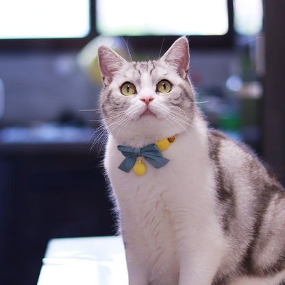 Mokka adjustable cat collar featuring bowknot and bell on neutral background