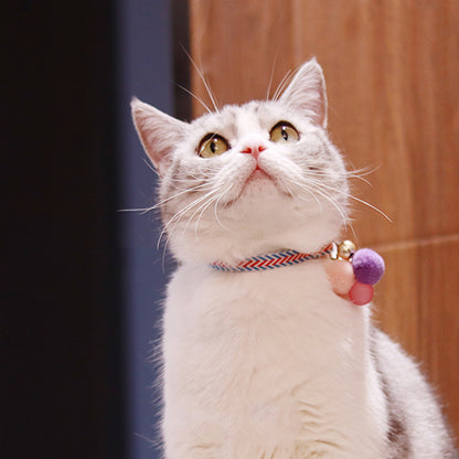 Mokka adjustable collar displayed with bell and colorful polyester strap