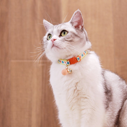 Mokka Valentine themed cat collar laid out with heart shapes on fabric