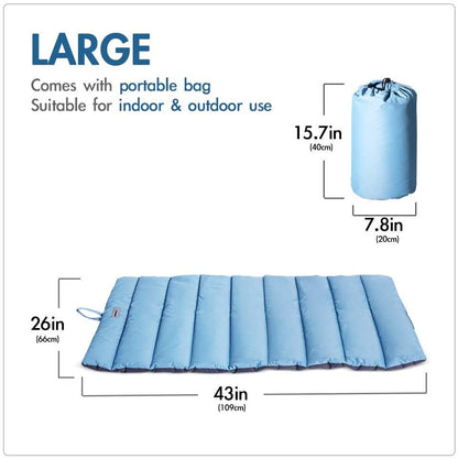 Folded outdoor dog bed in included carry bag next to mat for travel